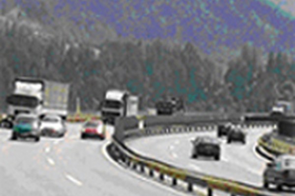 Trucks nose-to-tail on the Brenner, with or without rail tunnel